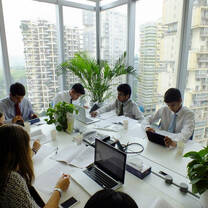Marketing Interns from internship in china program working hard in the office