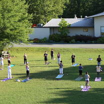 Integral Yoga Hatha class on the quad 