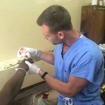 A PA attending to a patient at our placement in Mombasa, Kenya