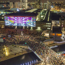 Aerial shot of Central Saint Martins during a festival