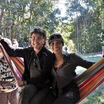 Students hanging out on a hammock