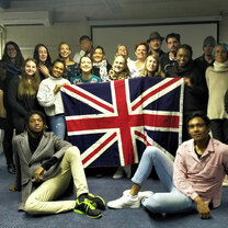 Graduates in Cape Town Graduates pose in front the British flag in Cape Town