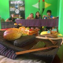 Participants making cacao (i.e. chocolate) 