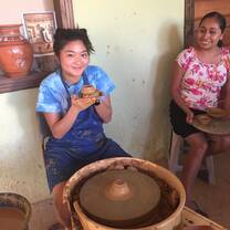 Participants making pottery