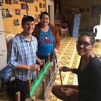Medical Fellows learning to weave