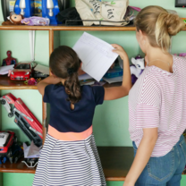 Education intern helping student