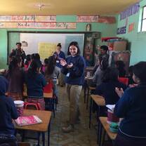 Participants teaching school lessons