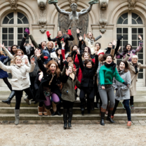 Group of students jumping during trip to Paris