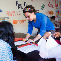 woman assisting a student 