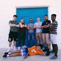 Posin in front of this vibrant door