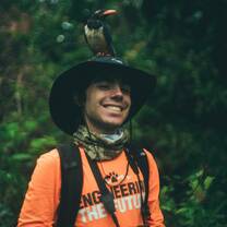 Student with a bird on their head