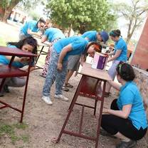 Making bachi & desks to furnish class-rooms. 