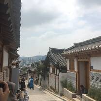 A path through a traditional village. Where traditional meets modern, a neighborhood nestled at the top of hill; a brief getaway from the city. 