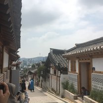 A path through a traditional village. Where traditional meets modern, a neighborhood nestled at the top of hill; a brief getaway from the city. 