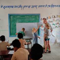 Family volunteering in a village school.