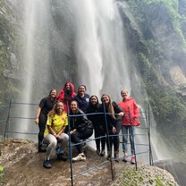 Standing below the Chorrera Waterfall in Colombia