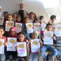 Students showing their work from Science class with SB OverSeas in Lebanon!