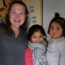 Volunteers and moms work side by side