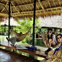 Volunteers relax in hammocks in the Philippines