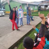 Volunteers teaching a health education lesson in the community. 