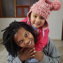 Volunteer having fun with children in the community. 