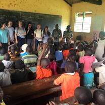 Volunteers leading a health education session in a local school.