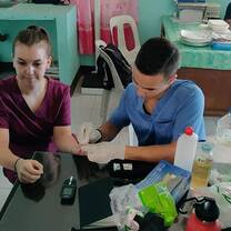 Volunteers taking glucose levels.