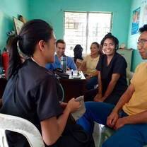 Volunteers learning to take vitals. 