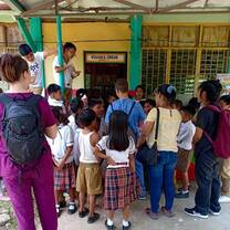 Volunteers helping at a school-based youth club.