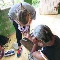 A volunteer conducting glucose checks. 