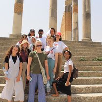 group of college students in front of Meknes Landmark