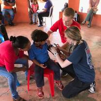 Volunteers taking vitals on the children in the community. 