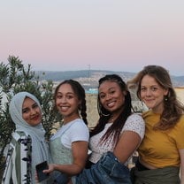 4 college female students with backdrop of tangier