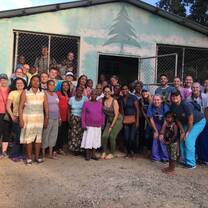 Volunteers with the community members of Restauración.