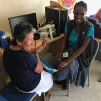 A volunteer helping to take blood pressure. 