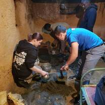 Volunteers building chimneys in order to alleviate respiratory illness in the community. 
