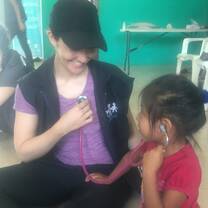 A volunteer having fun the kids of Anconcito!