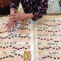 being able to touch a centuries-old song book made of sheep's skin at the Monastery in Catania.