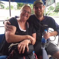 Riding the open air bus to village of Surin, Thailand