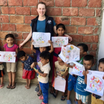 A volunteer teaching children about nutrition!