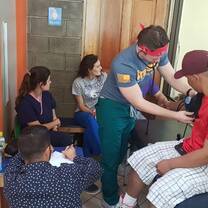A volunteer helping to take blood pressure at the clinic. 