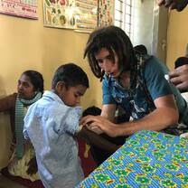 A volunteer helping out at a creche. 