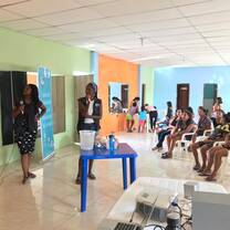 A volunteer leading a health education lesson.