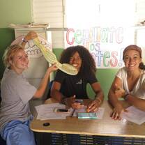 Volunteers teaching a health education lesson on dental hygiene.