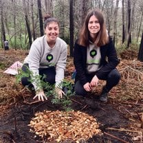 The first tree we planted at Greenpop's Festival of Action - me and my friend Bailey sitting proudly by our first tree!