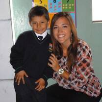 Volunteer with her student after culminating a teaching English program.