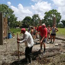 Working alongside community members in the construction of the community center 