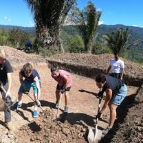 Students digging the base for community water tank 