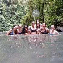 A portion of our group cooling off in the waterfall after surviving the descent of +500 steps, and preparing to make the trek back up to the top. 