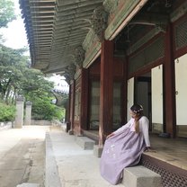 At 경복궁 wearing a 한복